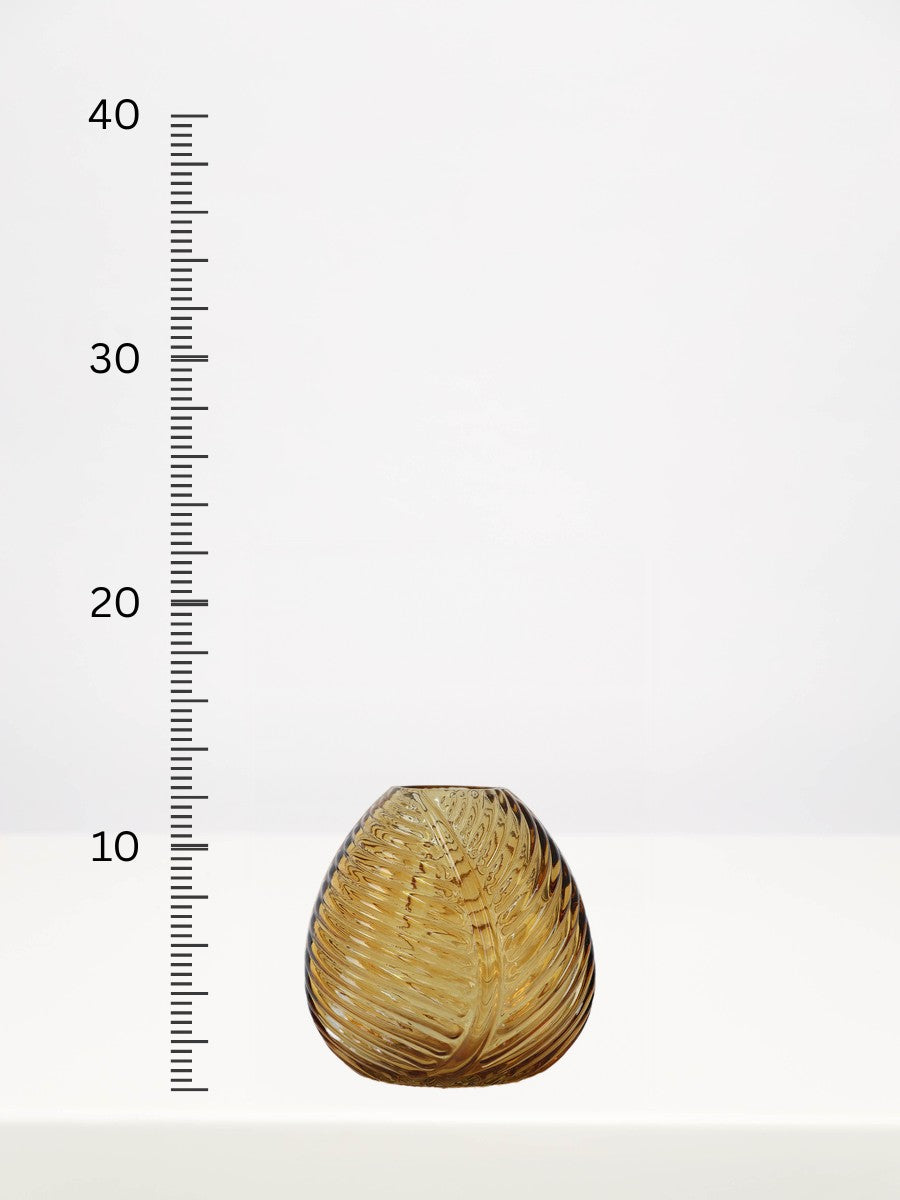 Amber Leaf Bud Vase - 12cm next to a centimetre ruler showing its height