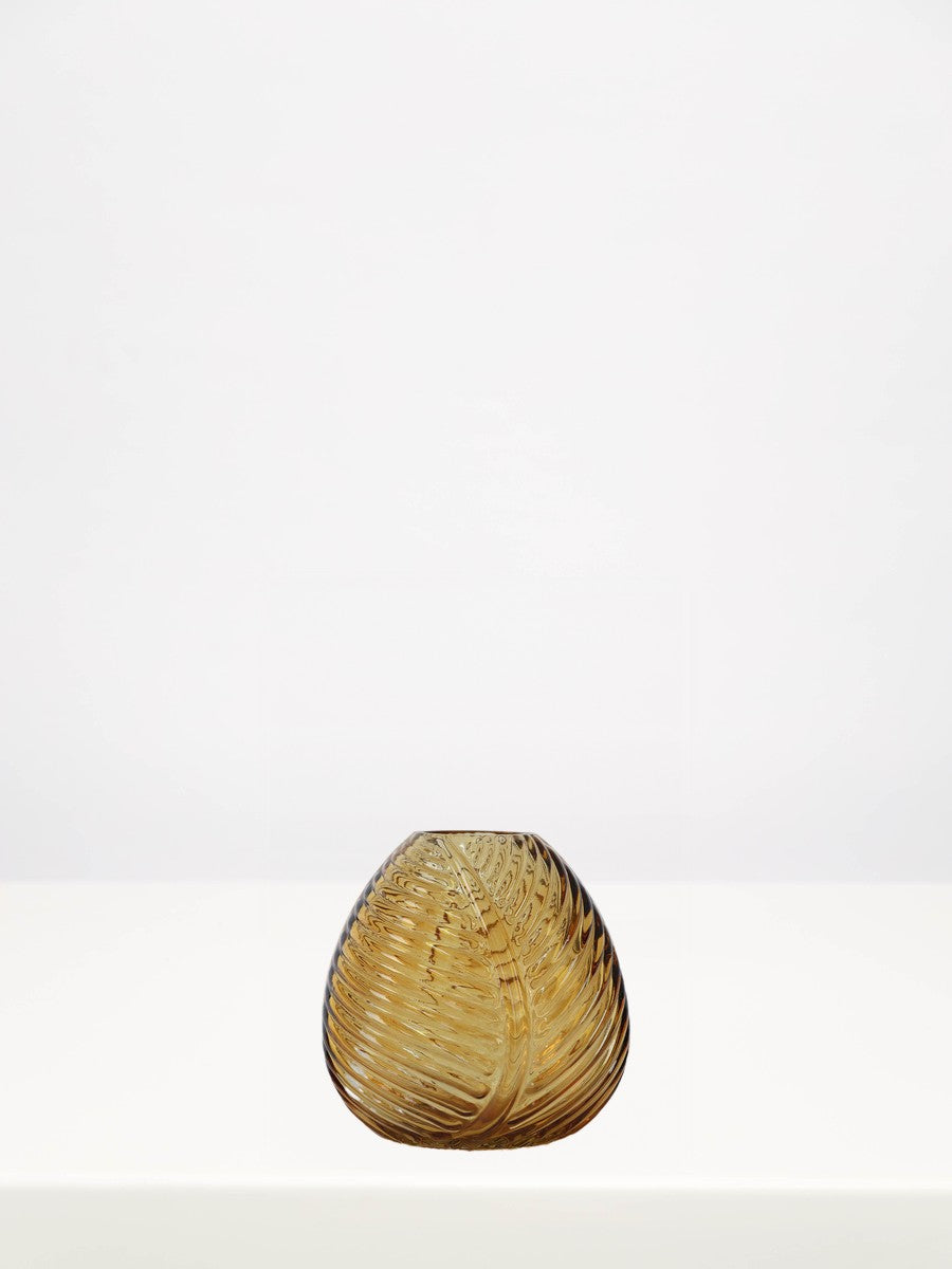 Amber Leaf Bud Vase - 12cm on a white table against a soft grey wall