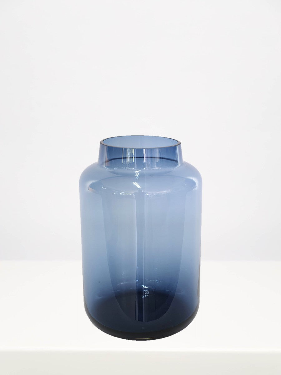 Bermuda Blue Vase - 26cm on a white table against a soft grey wall