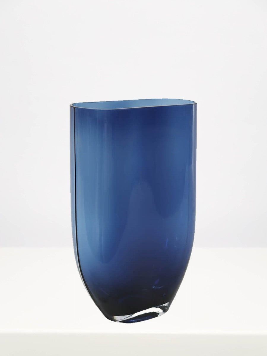 Blue Oval Vase - 30cm on a white table against a soft grey wall