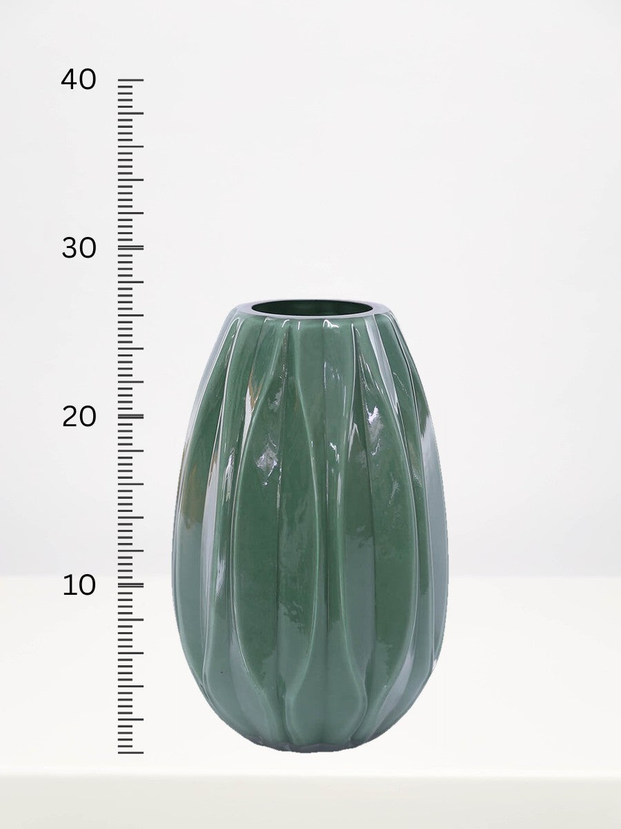 Fern Green Vase - 26cm next to a centimetre ruler showing its height