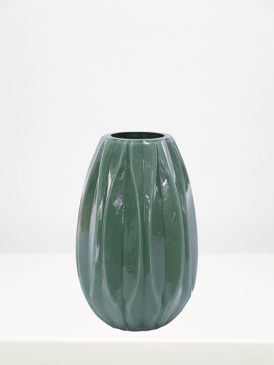 Fern Green Vase - 26cm on a white table against a soft grey wall