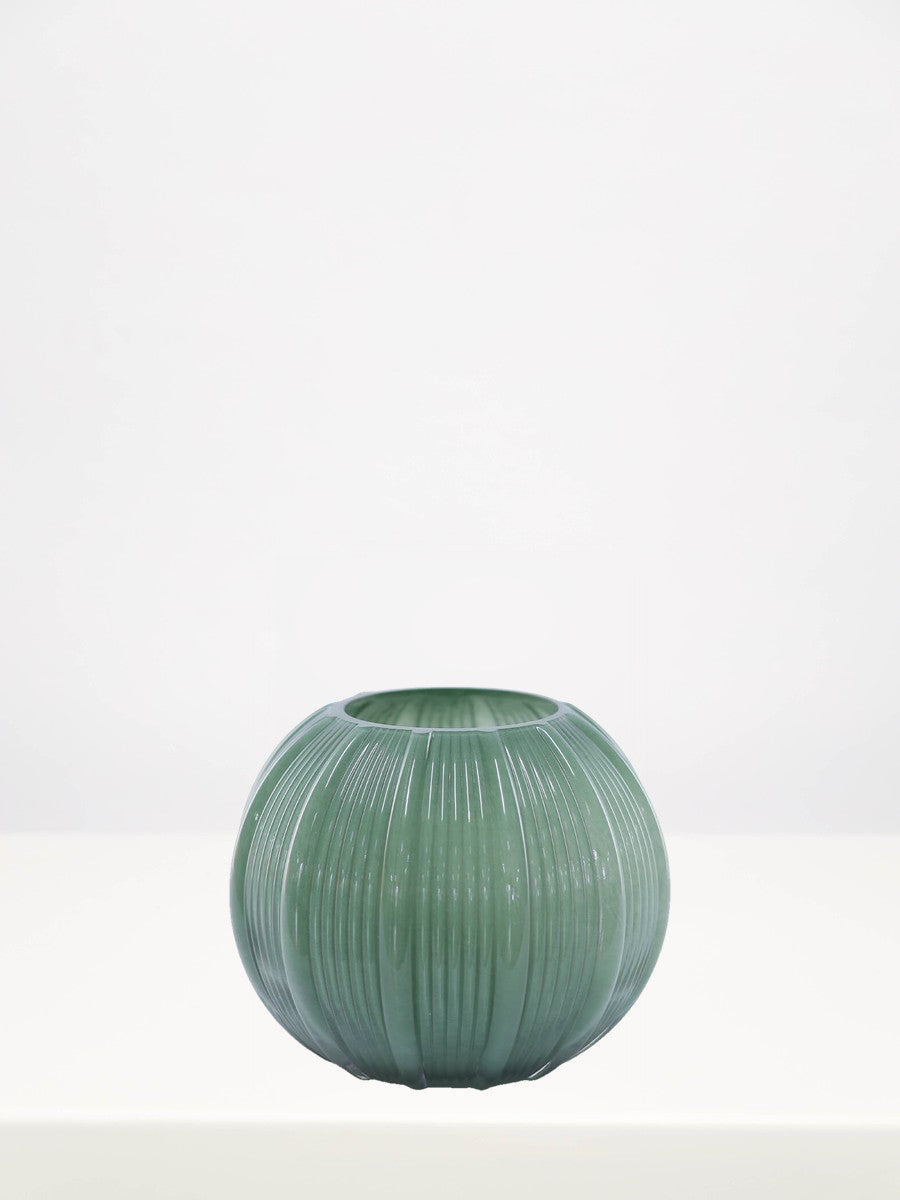 Fern Green Stripe Ball Vase - 16cm on a white table against a soft grey wall