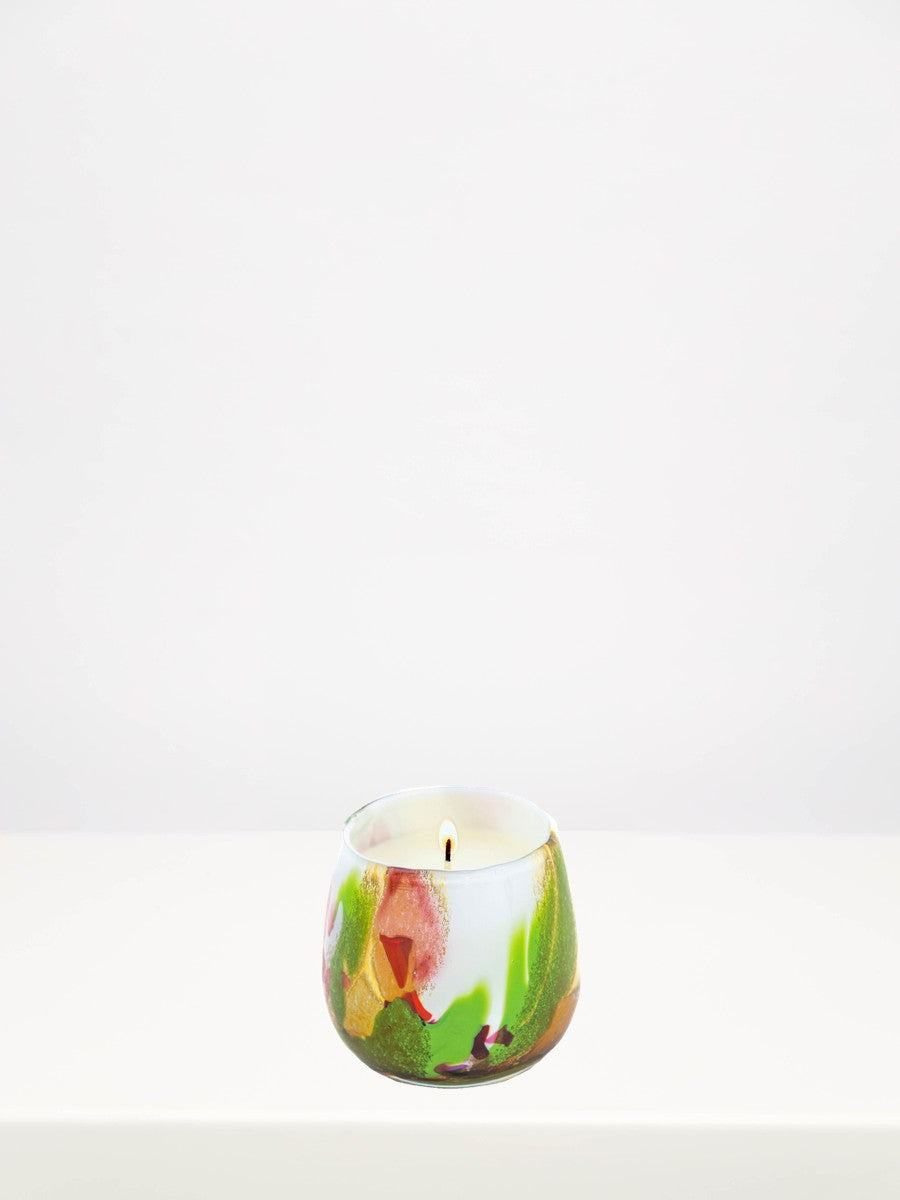Fidrio - Mixed Colours Candle - Medium on a white table against a soft grey wall
