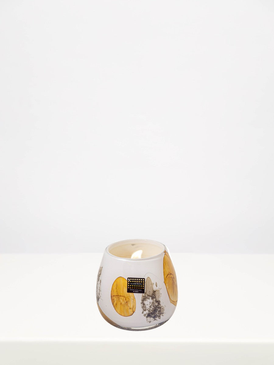 Fidrio - Vulcany Serene Symphony Candle - Medium on a white table against a soft grey wall