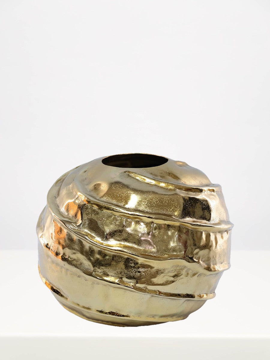 Gold Spiral Mbala Vase - 23cm on a white table against a soft grey wall