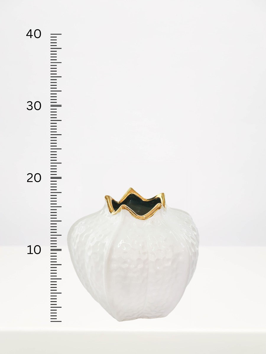 Gold & White Pomegranate Vase - 18cm next to a centimetre ruler showing its height