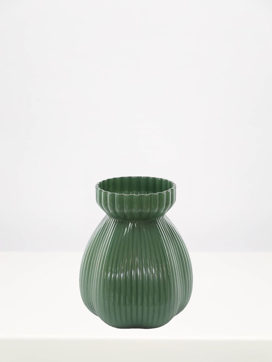 Green Tinted Vase - 20cm on a white table against a soft grey wall