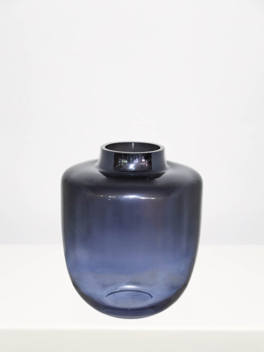 Midnight Blue Urn Vase - 24cm on a white table against a soft grey wall