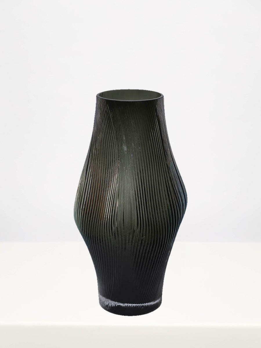 Remi Grey Vase - 31cm on a white table against a soft grey wall