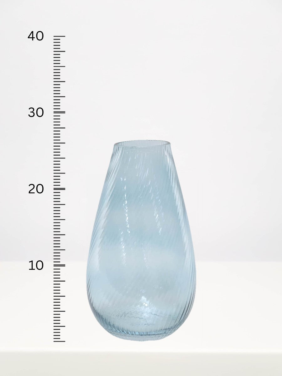 Soft Blue Ribbed Vase - 25.5cm next to a centimetre ruler showing its height