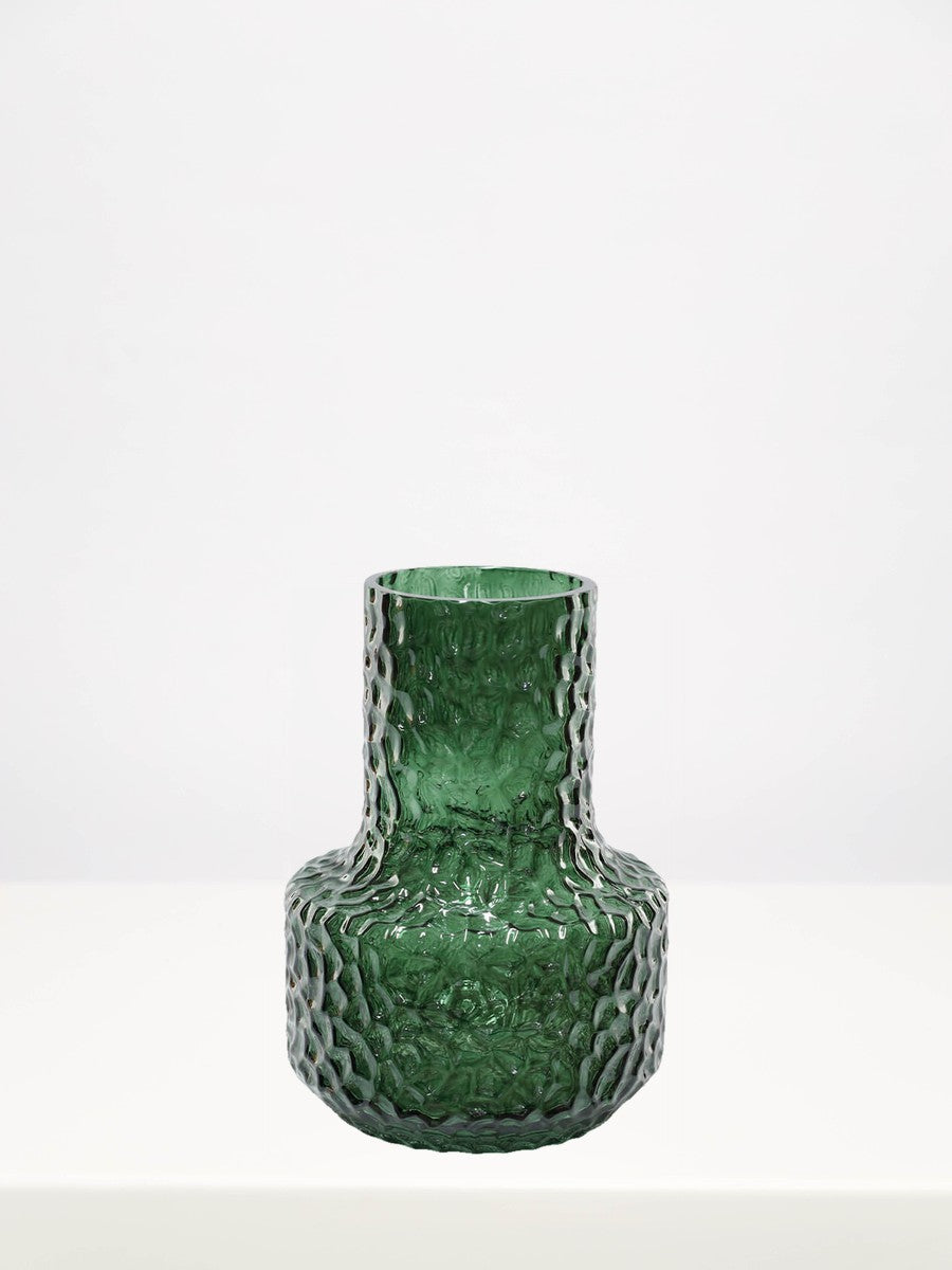 Textured Green Vase - 22cm on a white table against a soft grey wall