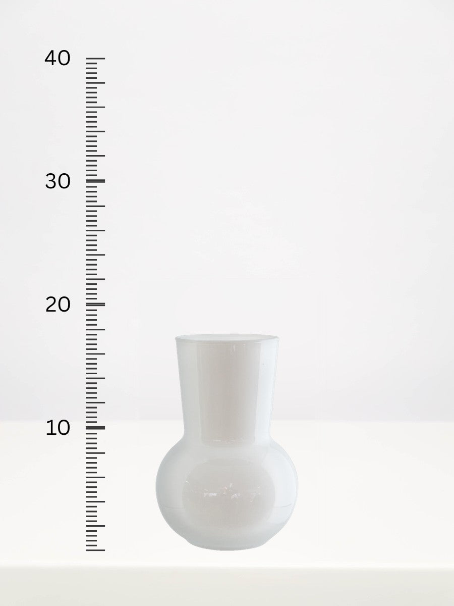 White Adele Mini Vase - 17cm next to a centimetre ruler showing its height