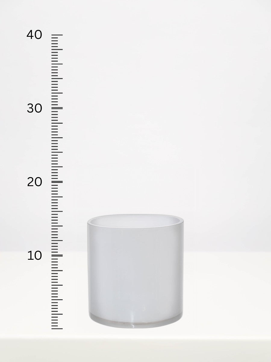 White Round Cylinder Vase - 15cm next to a centimetre ruler showing its height
