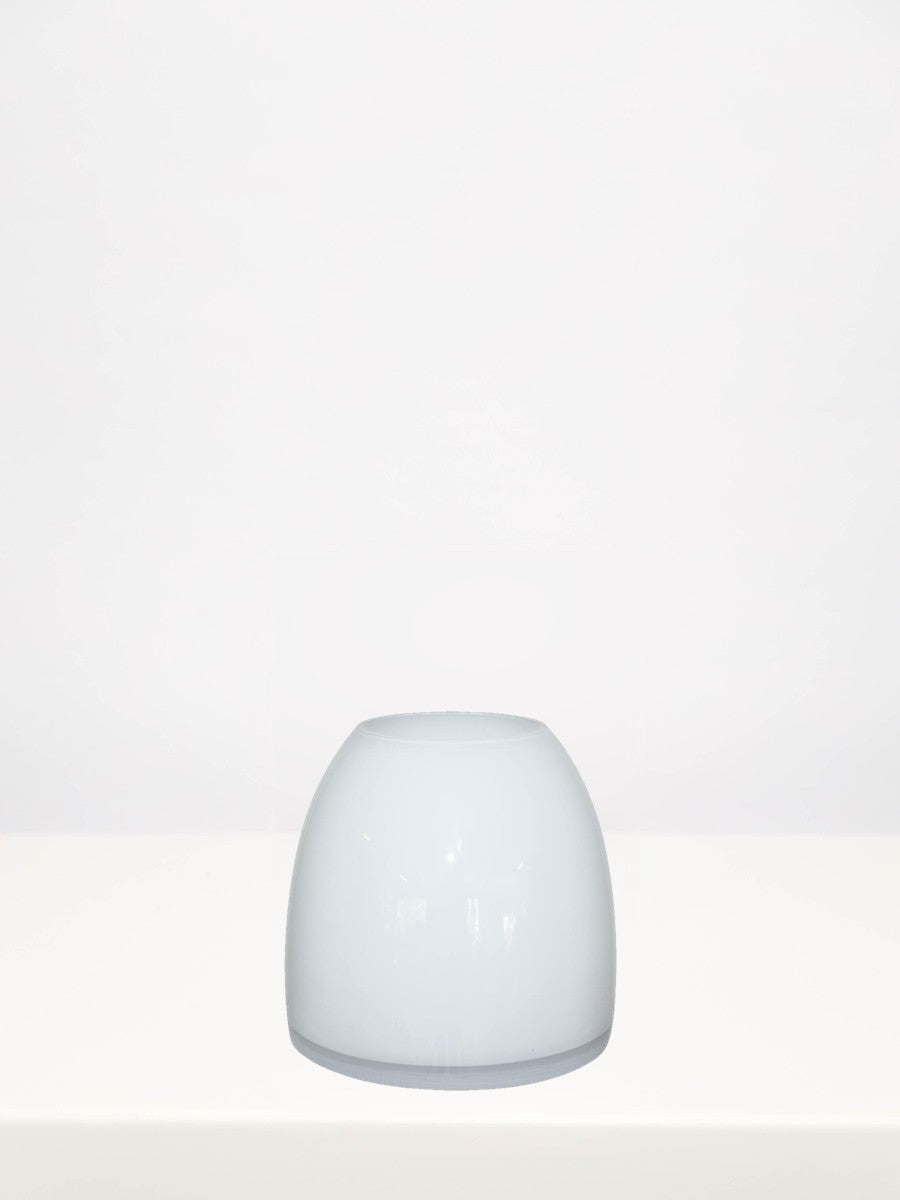 White Squat Vase - 15cm on a white table against a soft grey wall